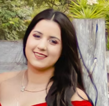 Young woman with long dark hair smiling